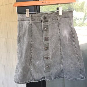 Olive green, high-waisted, button-down jean skirt.